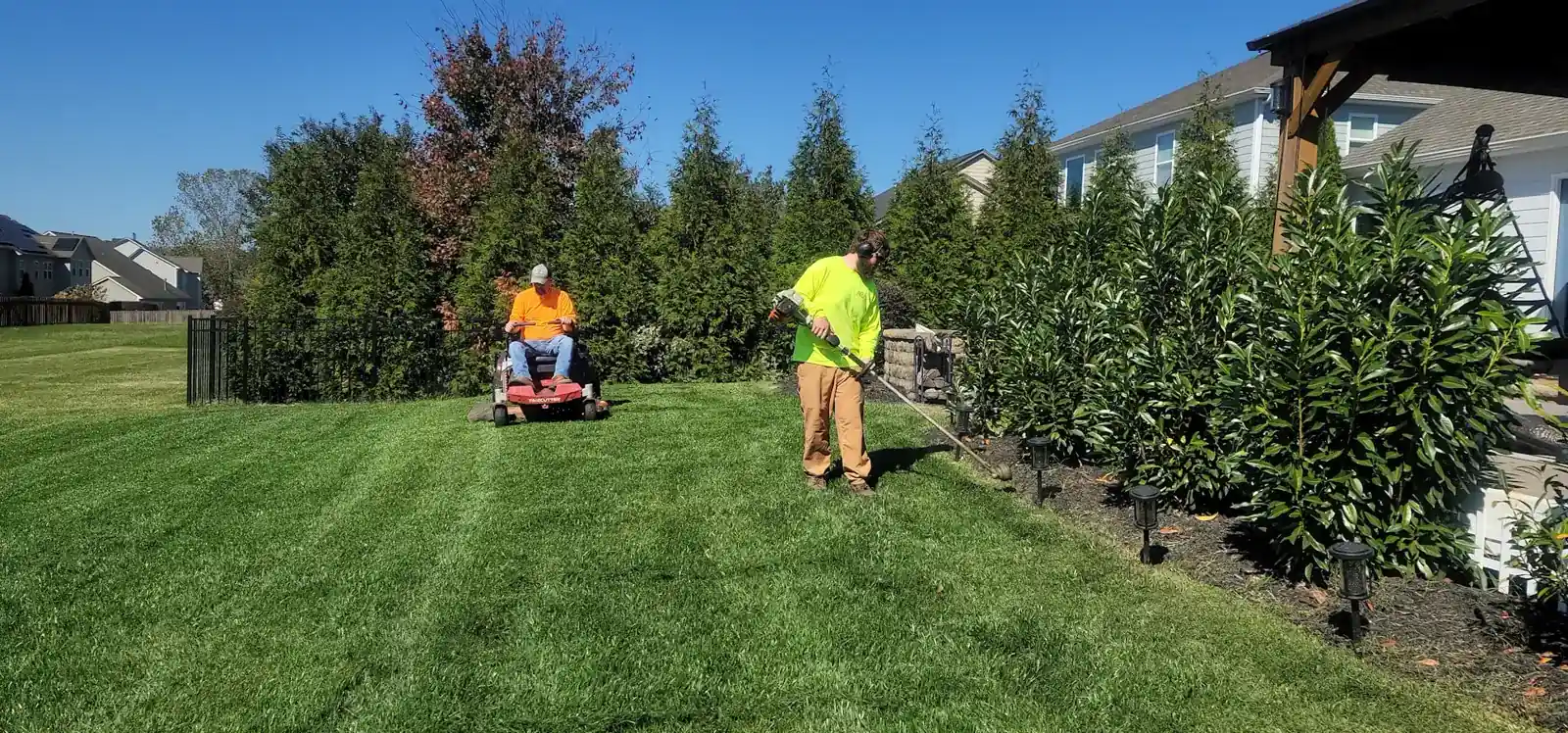 All Seasons crew maintaining shrubs and grounds